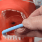 angle of the superslim tuft interspace brush in use