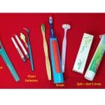 dental products on a red background showing you the order you should clean your teeth