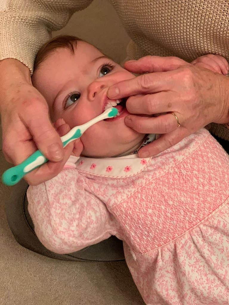 Start brushing as soon as the first tooth appears