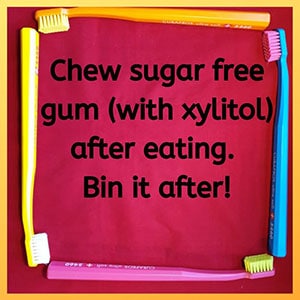 Chew sugar free gum (with xylitol) after eating. Bin it after!