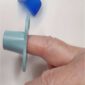 demo of dental finger shield on a small finger