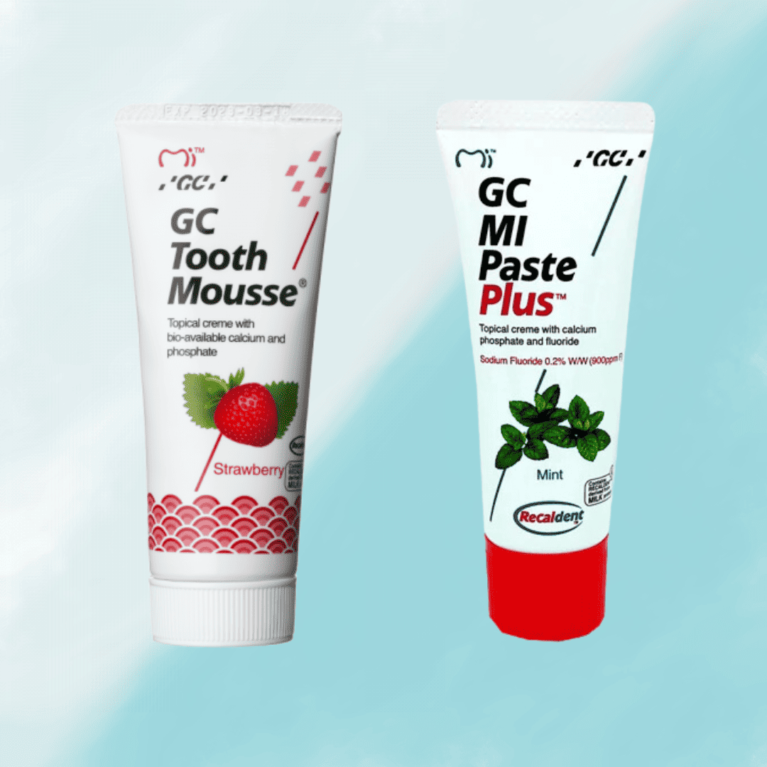 gc tooth mousse and mi paste plus on a buy background