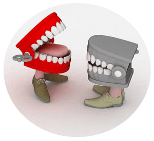 A grey and red set of teeth depicting talking to each other about oral health wearing shoes on a grey background
